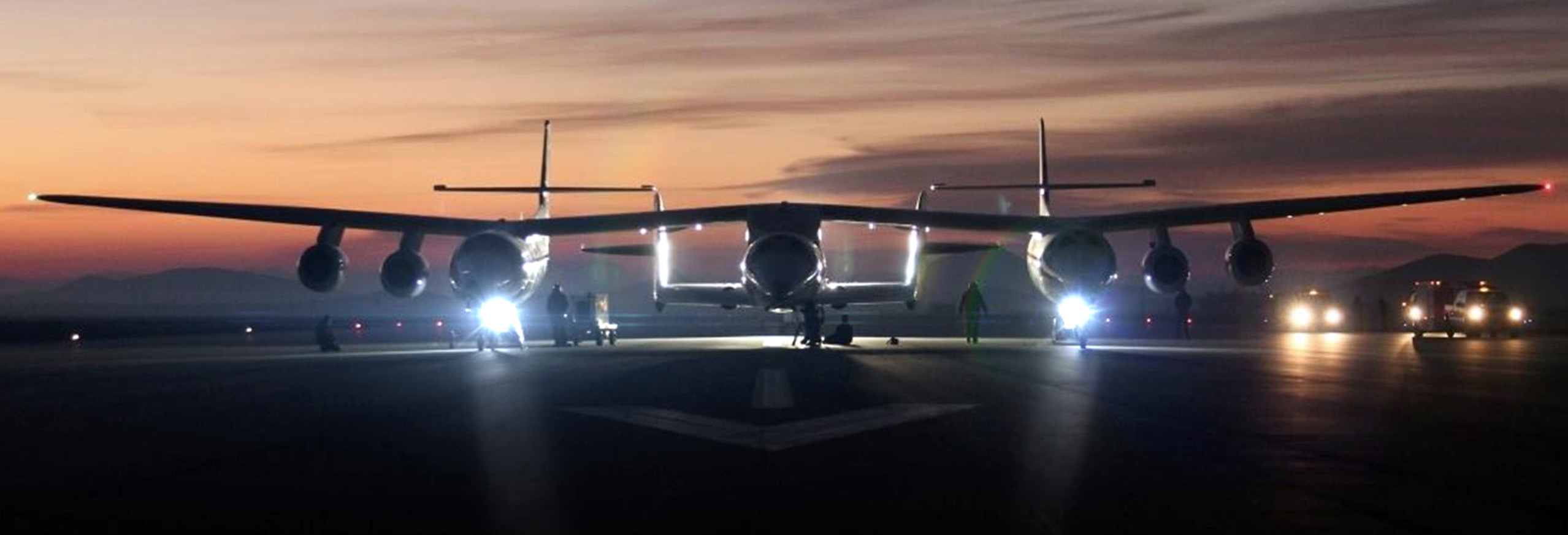 Aircraft on the runway at dusk with Aveo lights