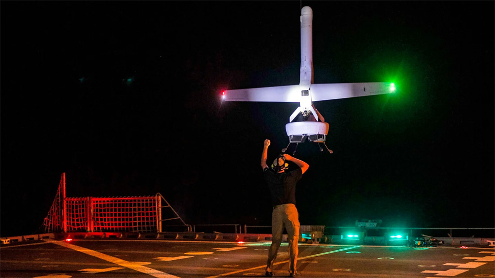 Aveo DroneV lights on a UAV recovered on a ship deck at night