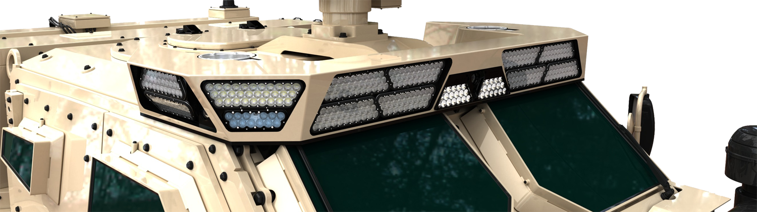 Aveo roof-mounted lighting array on a tan armored vehicle