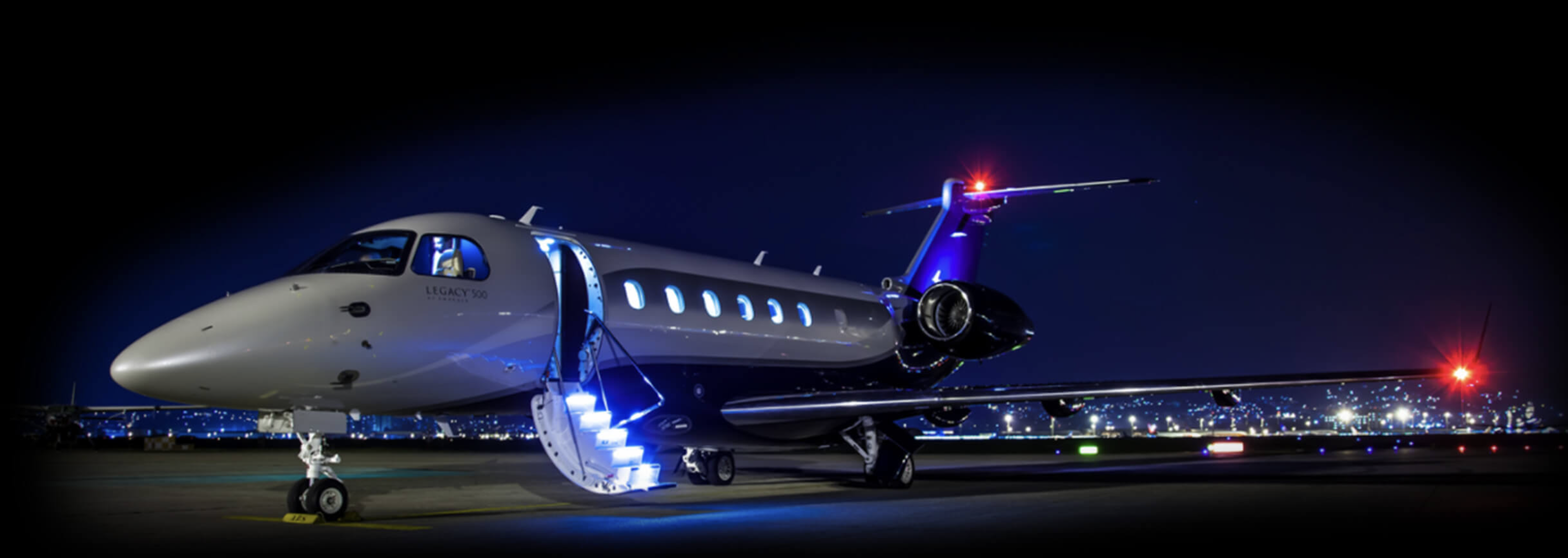 Business jet at night with Aveo nav and boarding lights