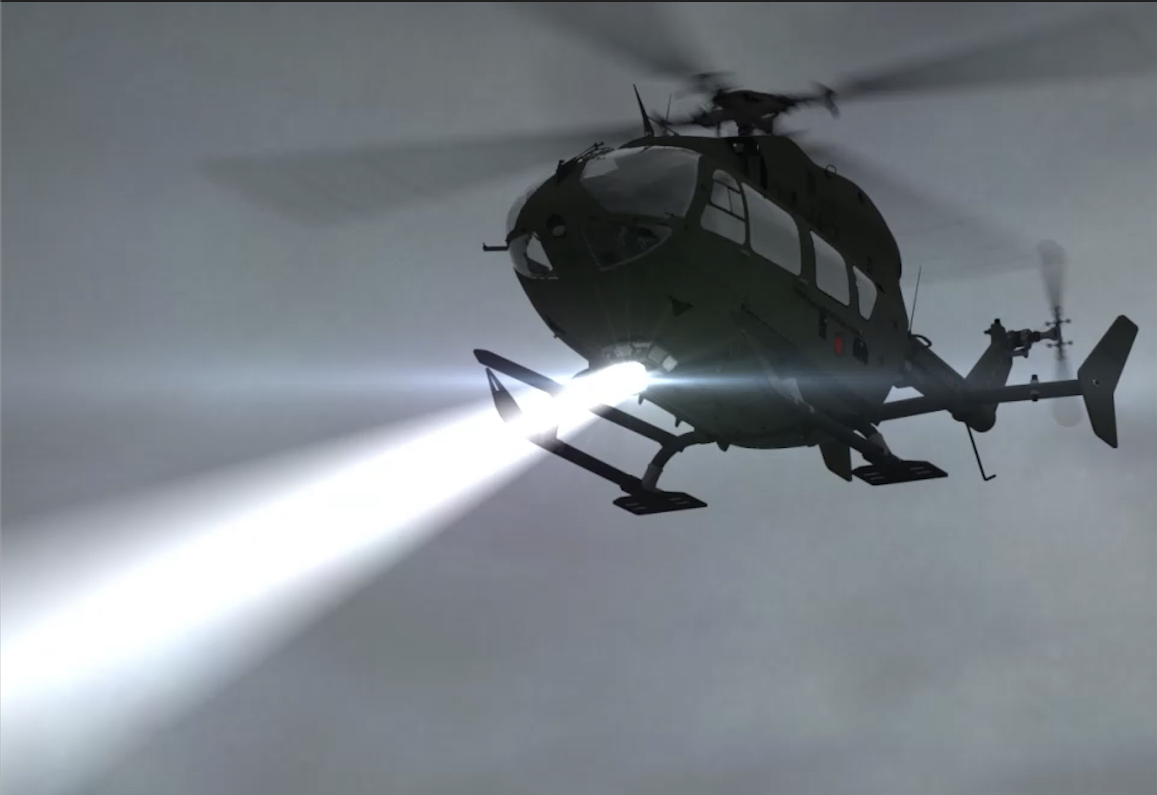 Military helicopter projecting a searchlight beam